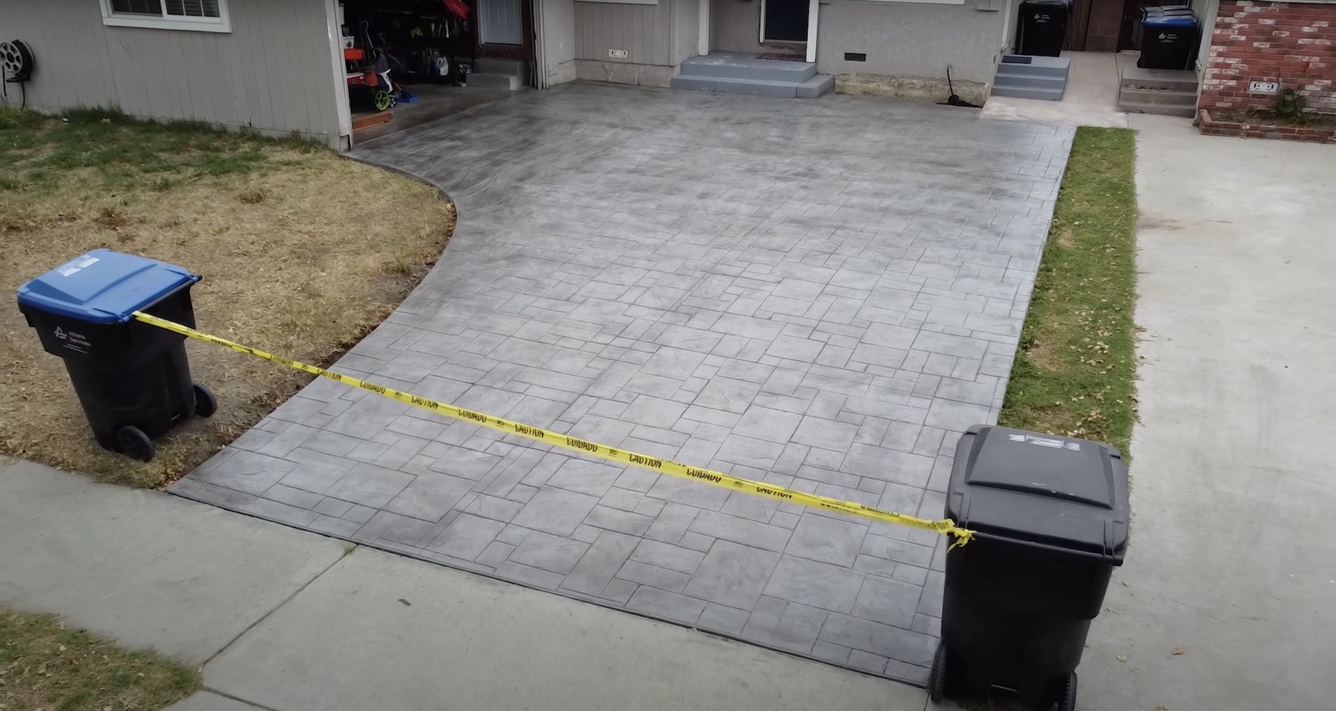 Professional concrete installation with paver-style pattern and expert finishing Beautiful paver-style concrete installation showing precision and attention to detail