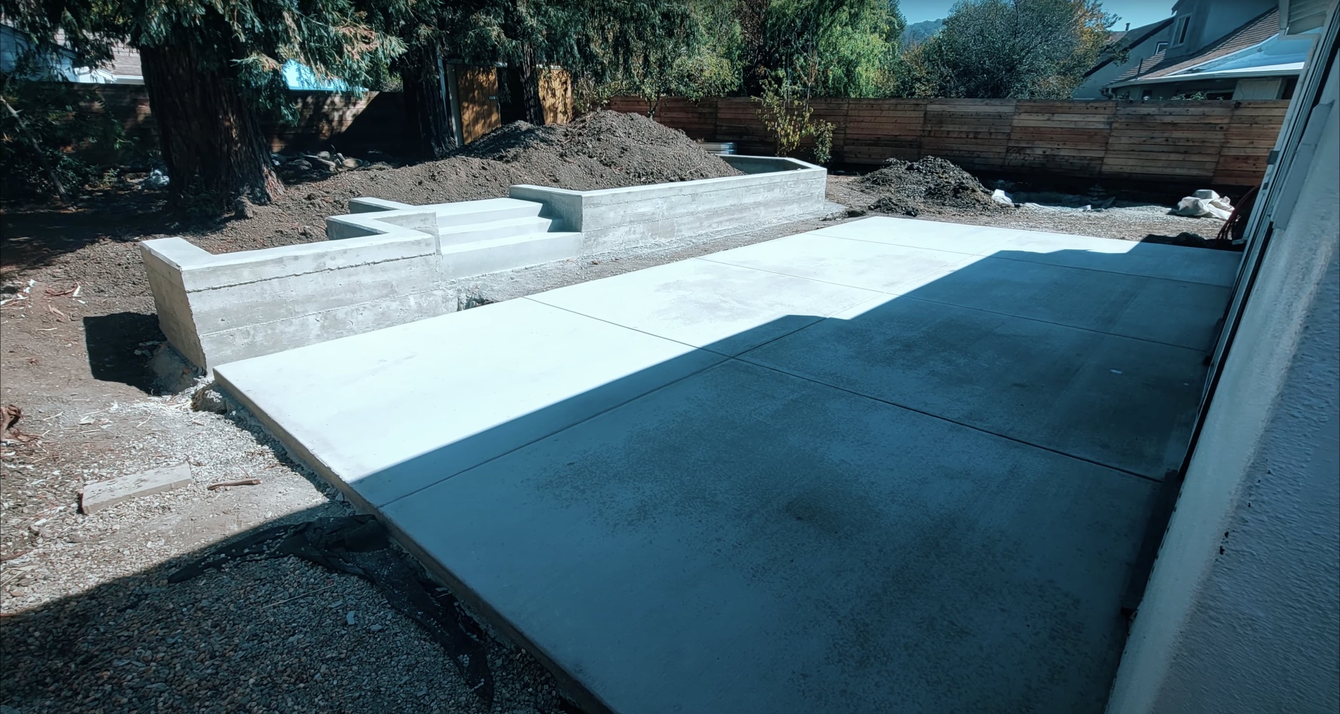 High-quality concrete patio installation with professional finish Beautiful finished concrete patio with clean lines and professional workmanship