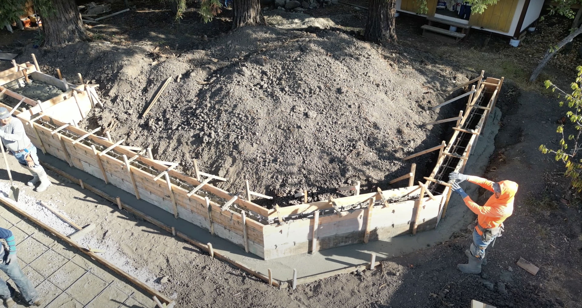Professional concrete foundation preparation and reinforcement Concrete foundation preparation with wooden forms and rebar reinforcement